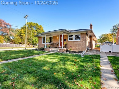 Bungalow-style house with covered porch, a chimney, brick siding, and a gate