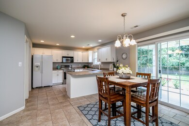 Kitchen and dining with bar seating