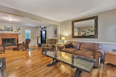Wide opening connects the living room and family r