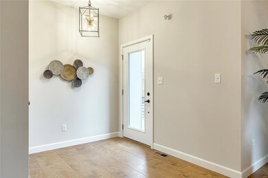 Nice entryway. Door on the left goes down to the l
