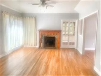 Den/family room with view of the sunroom.