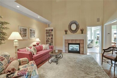 Family room features see through fireplace and har