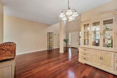 Another view of the dining room and entryway.