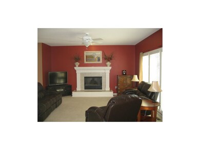 Living room that sits in an open floor plan next t