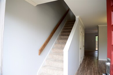 New, beautiful entry with laminate wood flooring.