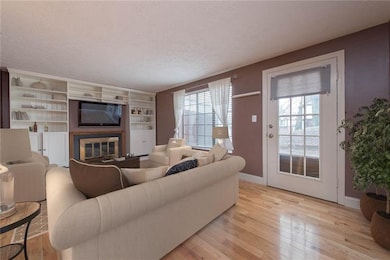 Family room opens to kitchen and has access to pat