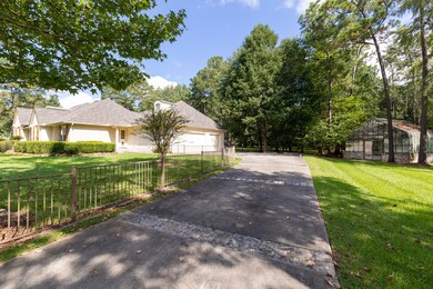Private and gated driveway to three car garage