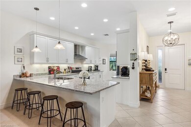 Spacious gourmet kitchen with counter top seating.