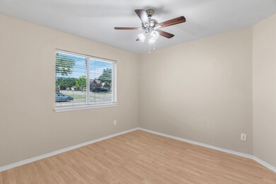 Spare room with light hardwood / wood-style flooring and ceiling fan