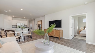 Living room with hardwood / wood-style flooring
