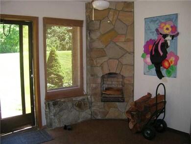 Sunroom. Enjoy the fireplace.