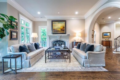 The living room features a fireplace and terrace.