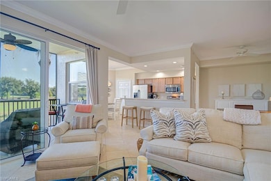 Living room with a ceiling fan, recessed lighting,