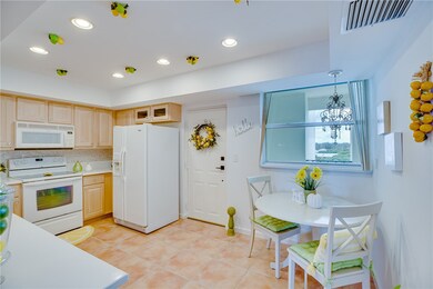 Crisp, clean kitchen. Hard stone countertops and m