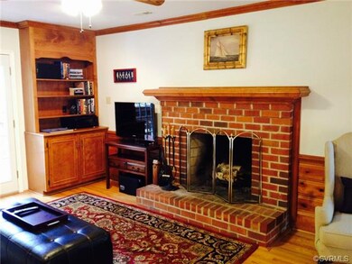 Family Room's wood-burning Fireplace with raised h