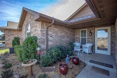 Doorway to property featuring a patio area