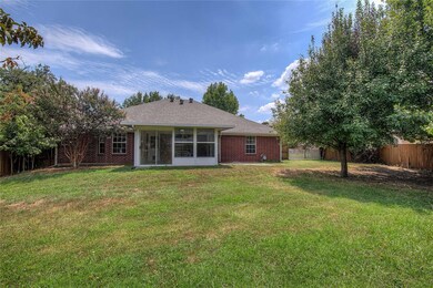 Back of property featuring a lawn