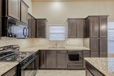 There is also plentiful recessed lighting, under-cabinet lighting and a gas stove for the cook in the family, & of course, dishwasher and microwave.