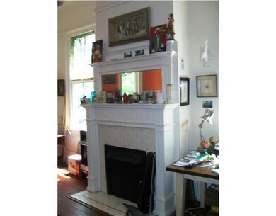 Living Room. Original fireplace mantel in living r
