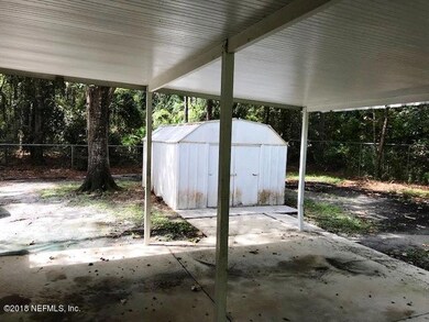 Carport with shed