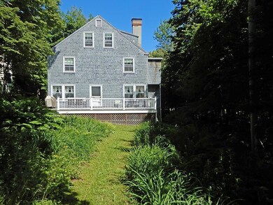 Back lawn and yard to house. Back...
