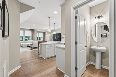 The entire main floor showcases gorgeous engineered hardwood floors.