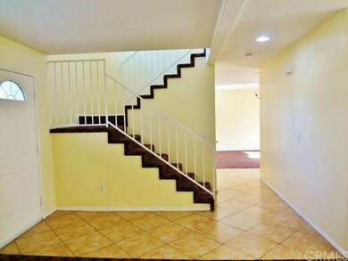 staircase and hallway to family room