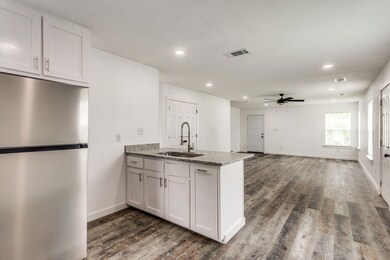 Kitchen with dark hardwood / wood-style flooring, 