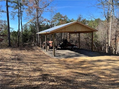 Surrounding community with a detached carport and driveway