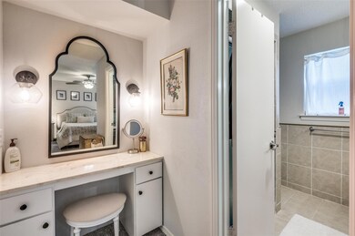 Bathroom featuring vanity, tile patterned flooring
