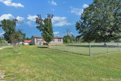 View of yard with a rural view