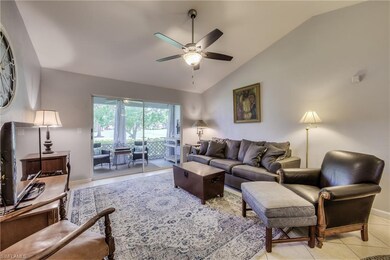 Living room with tall ceilings and views of golf c