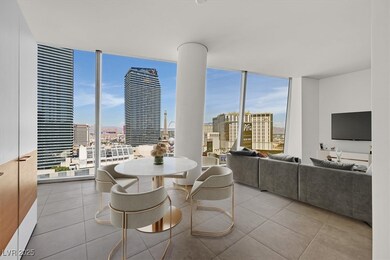 Dining room featuring a view of city, floor to cei