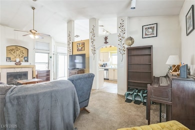 Living area featuring light colored carpet, lofted
