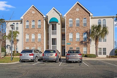View of property with uncovered parking