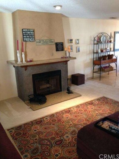 Living room with custom granite and marble firepla