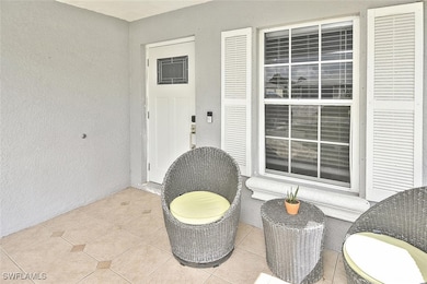 Entrance to property with stucco siding