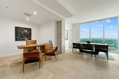 Office featuring baseboards, floor to ceiling win