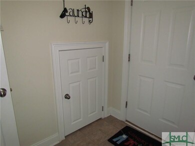 Extra large storage closet located in Laundry room