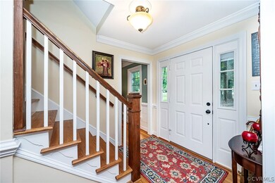 Entrance foyer with hardwood / wood-style floors a