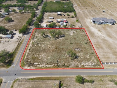 Aerial view of sparsely populated area with property boundaries highlighted