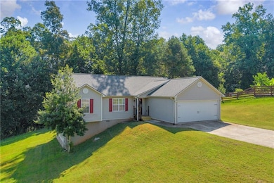 Ranch-style house featuring concrete driveway, an attached garage, crawl space, and roof with shingles