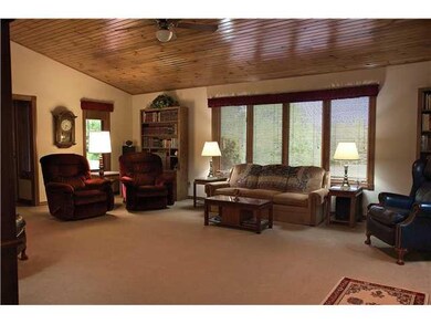 Great Room. Nice window view from front of home. Wood car siding ceiling. Space for all of friends and family!