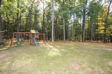 9837 N Woodbridge Ave, Bitely, MI 49309 - photo 7