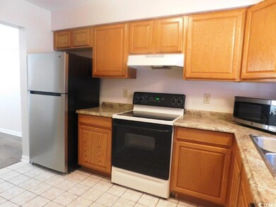 Kitchen featuring stainless steel appliances and l