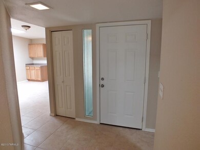 Foyer with main door and closet to left
