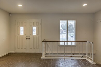 Double front doors welcome you into the spacious t