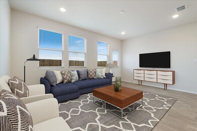 Living room with wood finished floors and recesse
