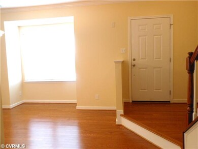 Foyer - Elevated entry to step down foyer and hallway.