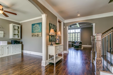 As you walk in, study to your left and dining to your right. The curved archways add an extra touch of character 